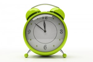 Green alarm clock isolated on white background 3D